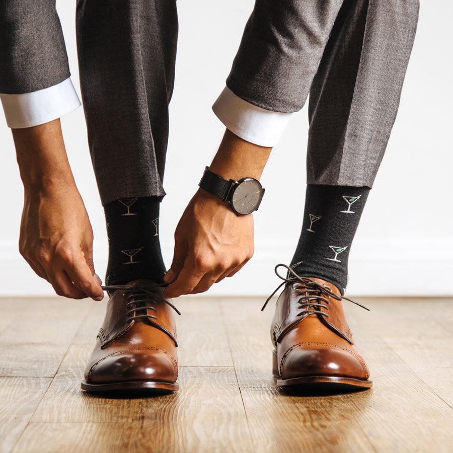 man tying a shoe lace