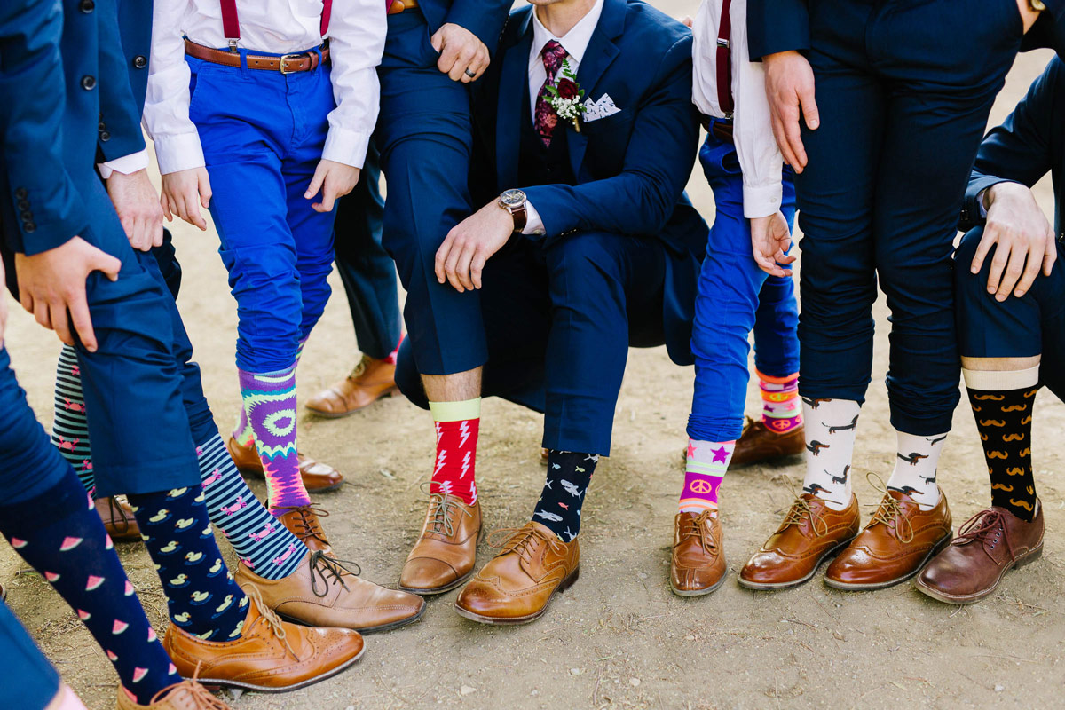 Groomsmen showing off various Ties.com patterned socks