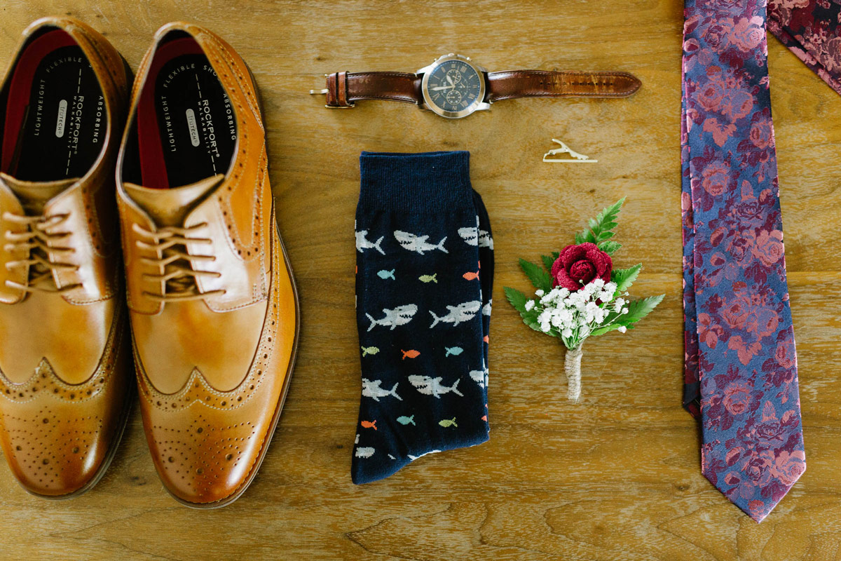 Flat lay of Ties.com products next to dress shoes