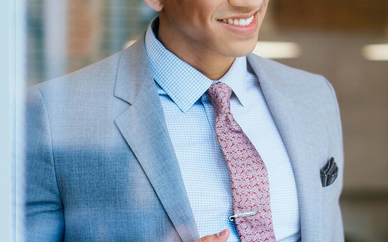 Man wearing Ties.com floral tie and grey suit