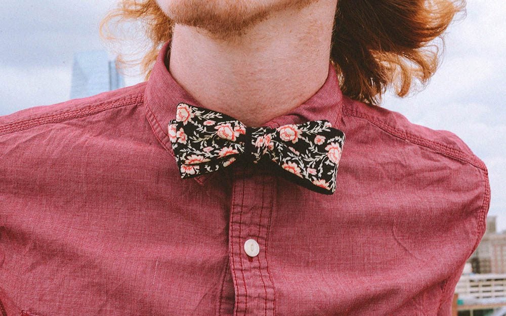 Batwing bow tie worn with a casual red shirt