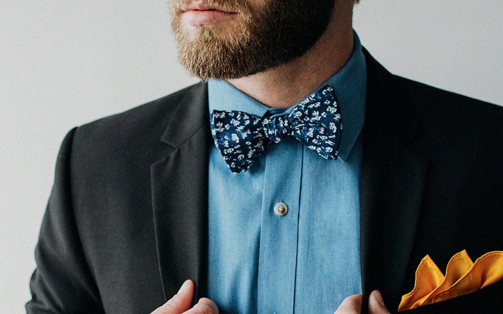 Man wearing floral bow tie