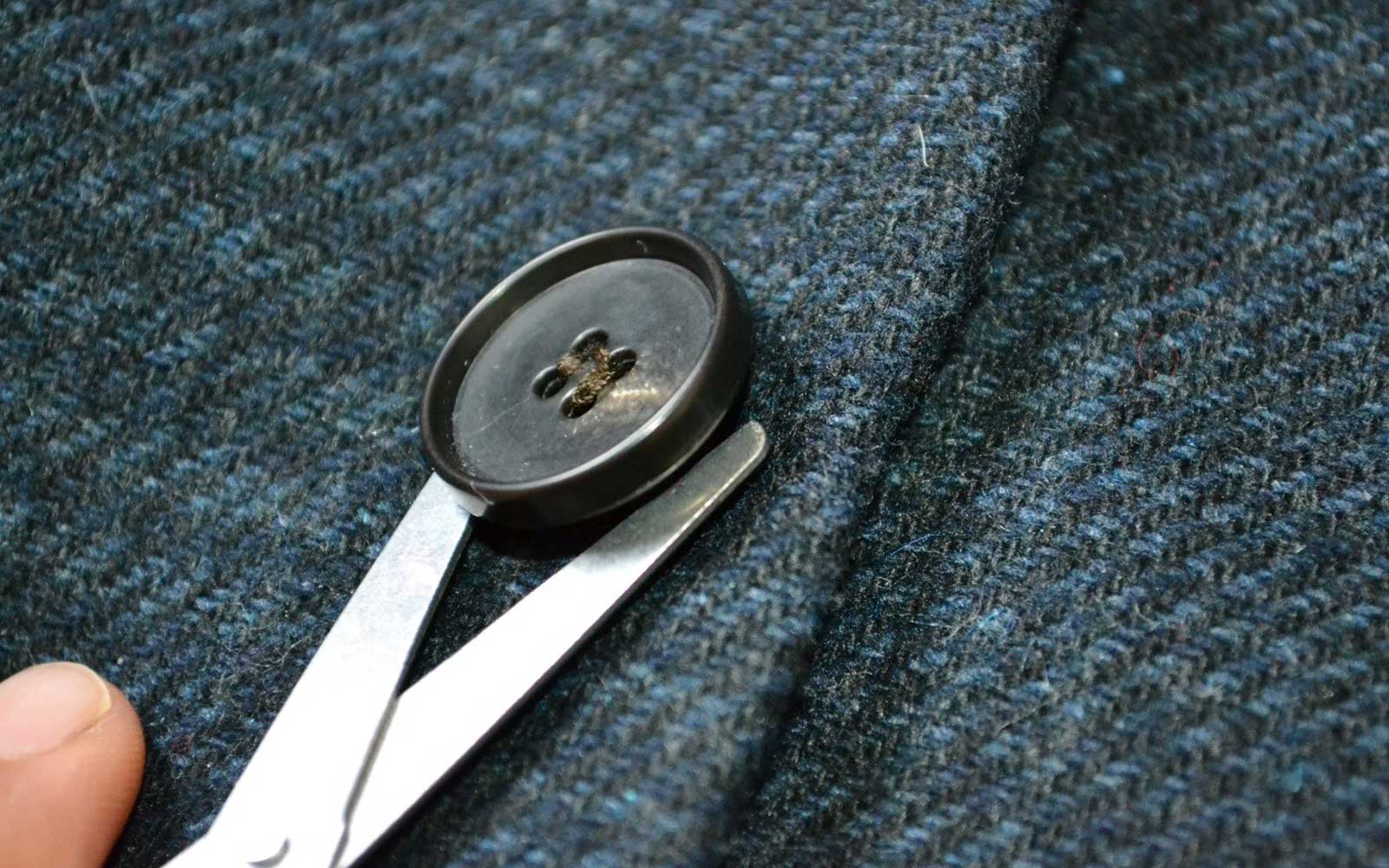 Cutting a button off blazer