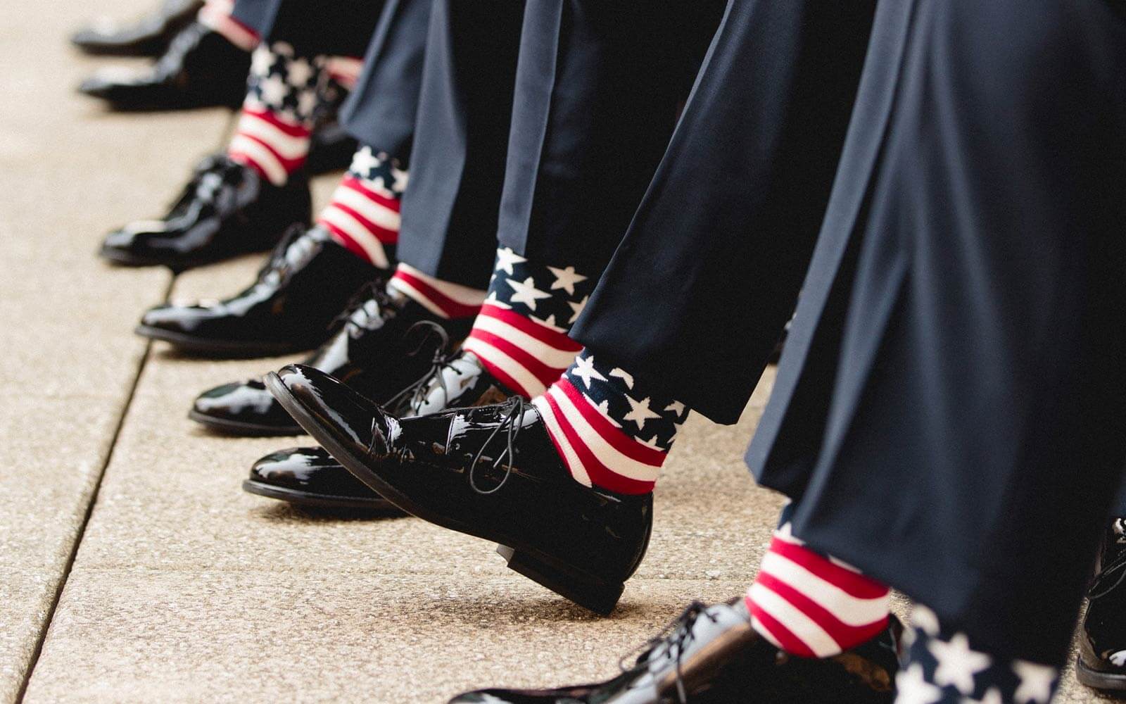 Men wearing American flag socks with slacks and dress shoes