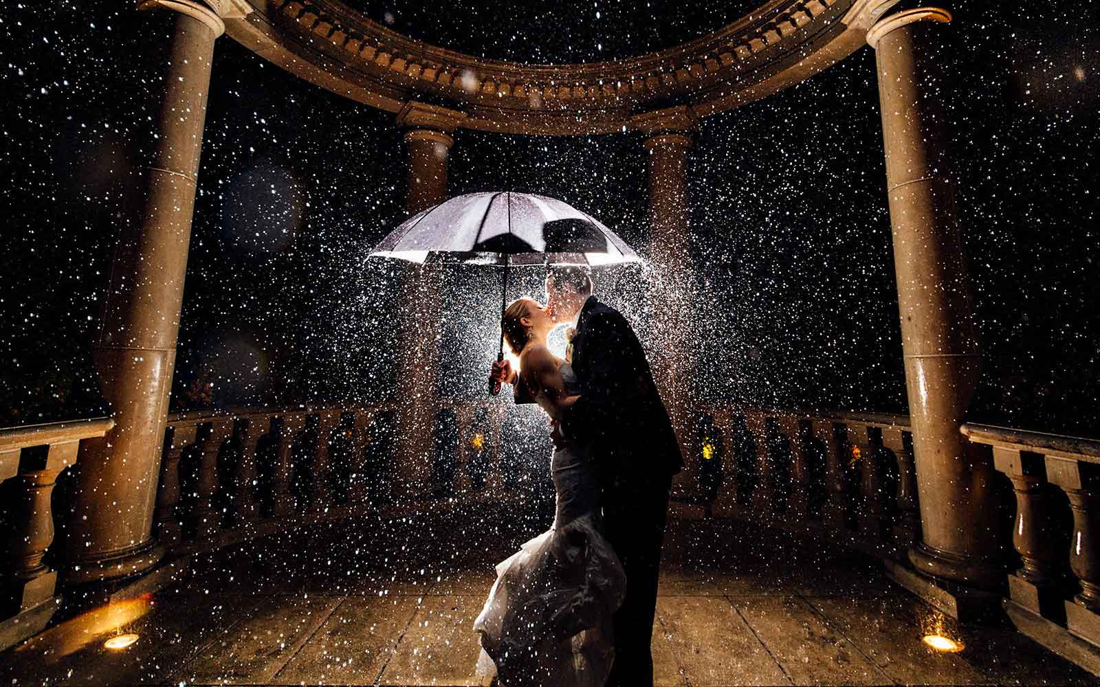 Couple kissing in the rain