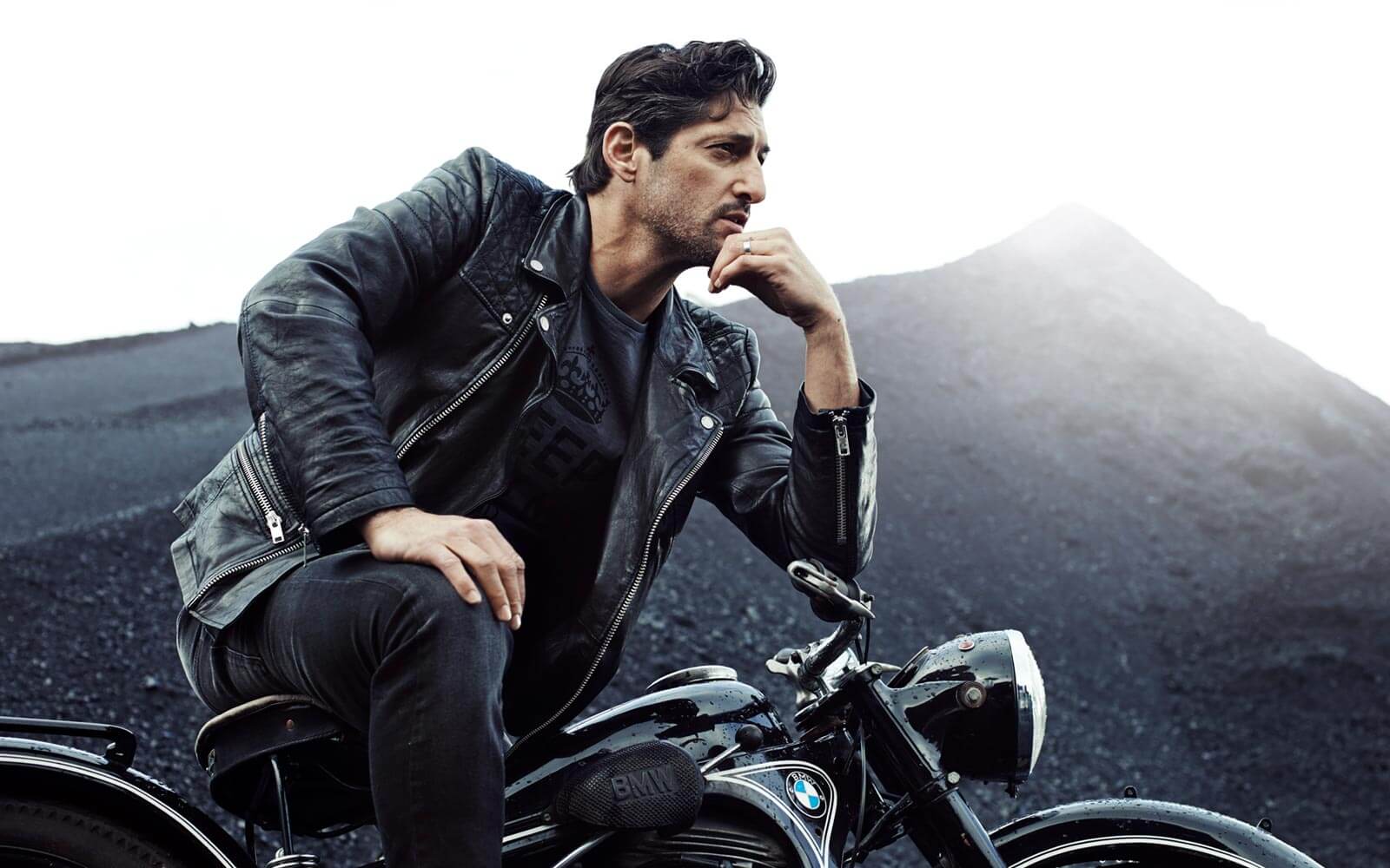 Man on motorcycle wearing a leather jacket
