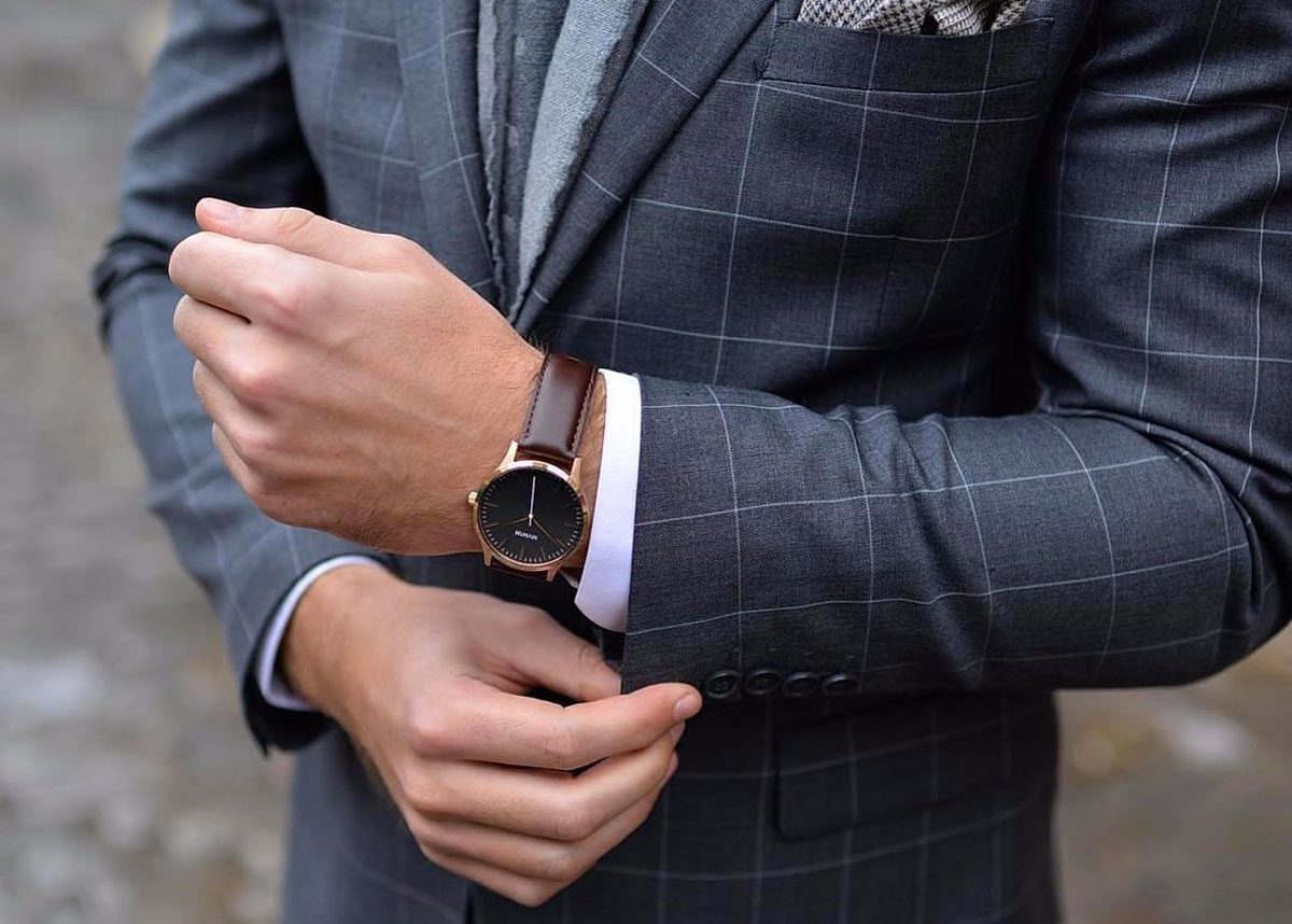 Man wearing a watch with a suit