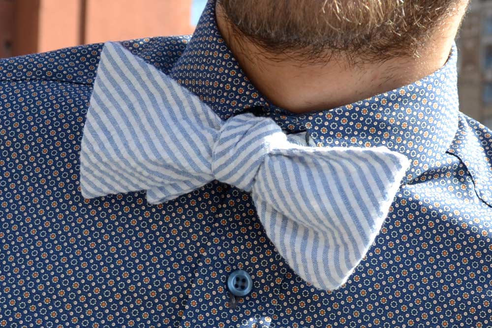 Chevron blue bow tie with a blue patterned shirt