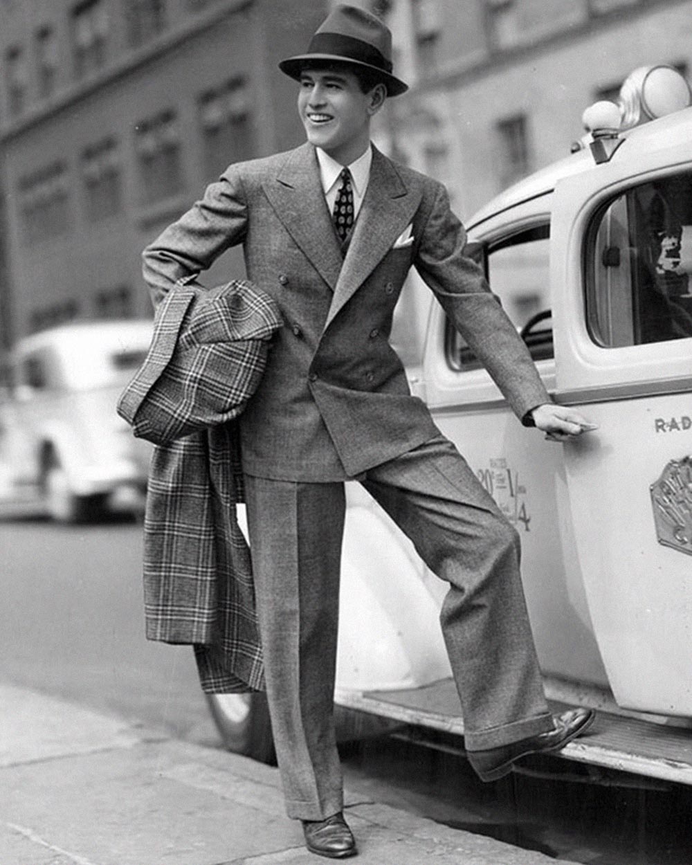 man in 1940s wearing a simple suit