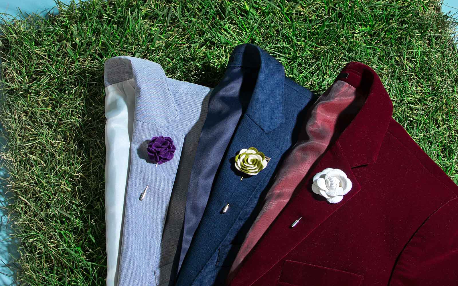 Collection of varying color blazers with Lapel Pins