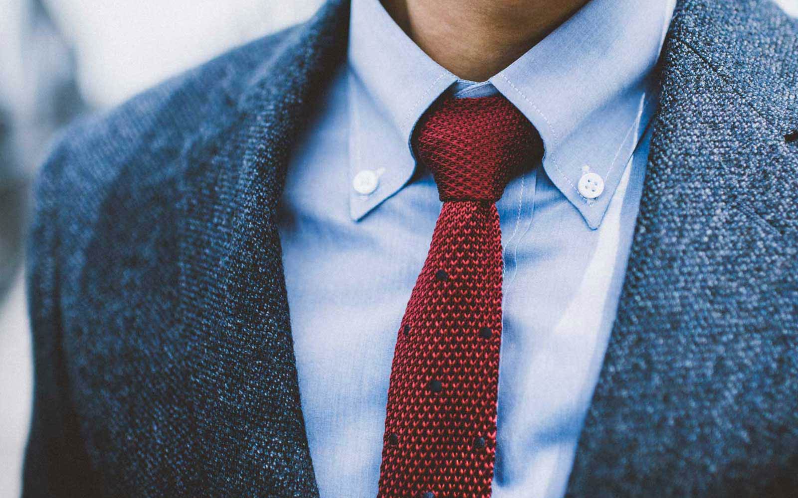 Man wearing a wool suit and red necktie