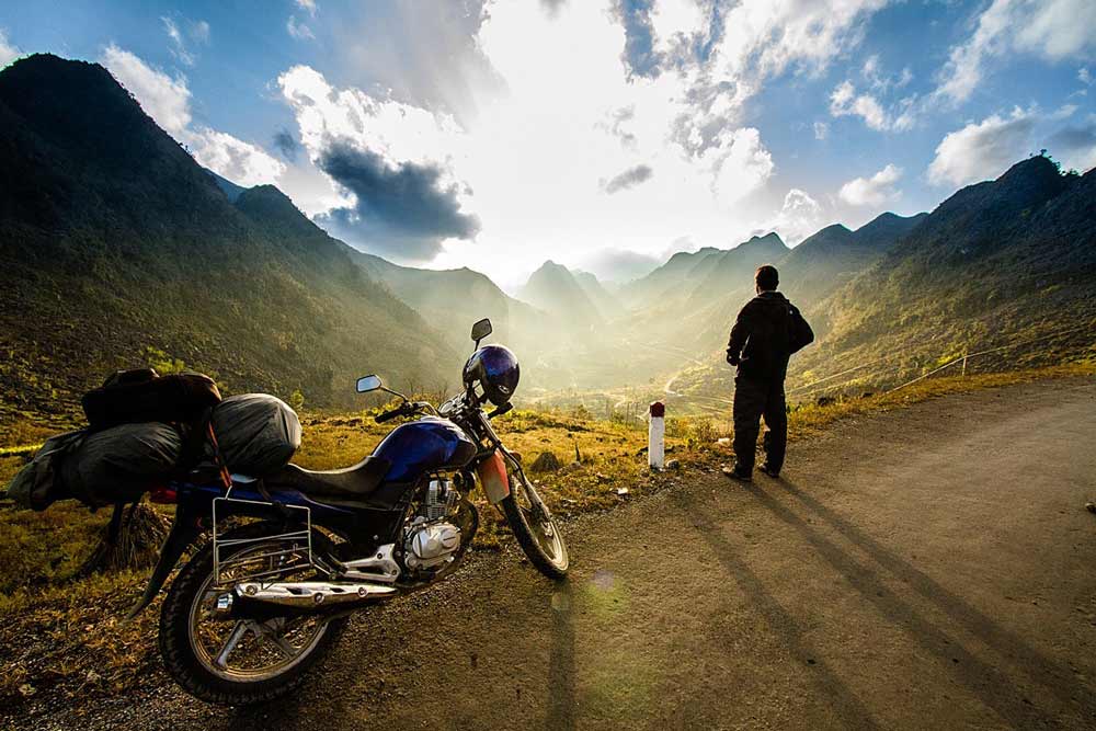 men-motorcycling-through-mountains