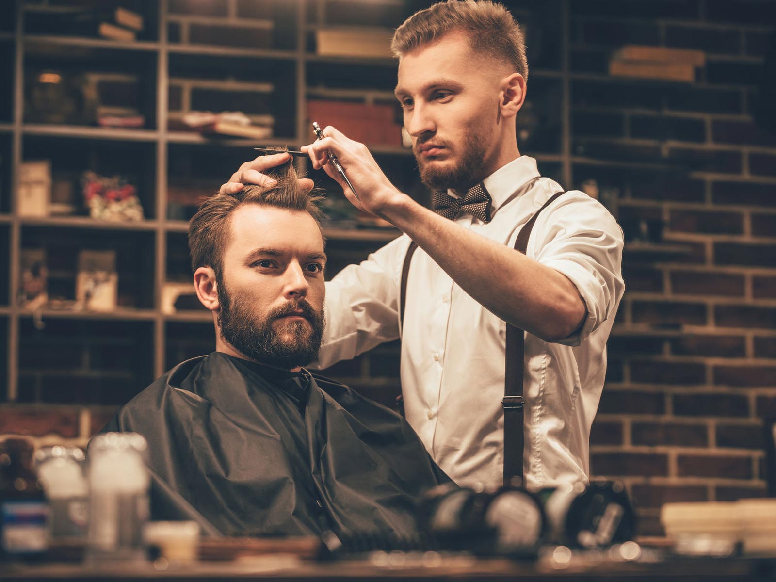 Man getting a haircut at barbershop