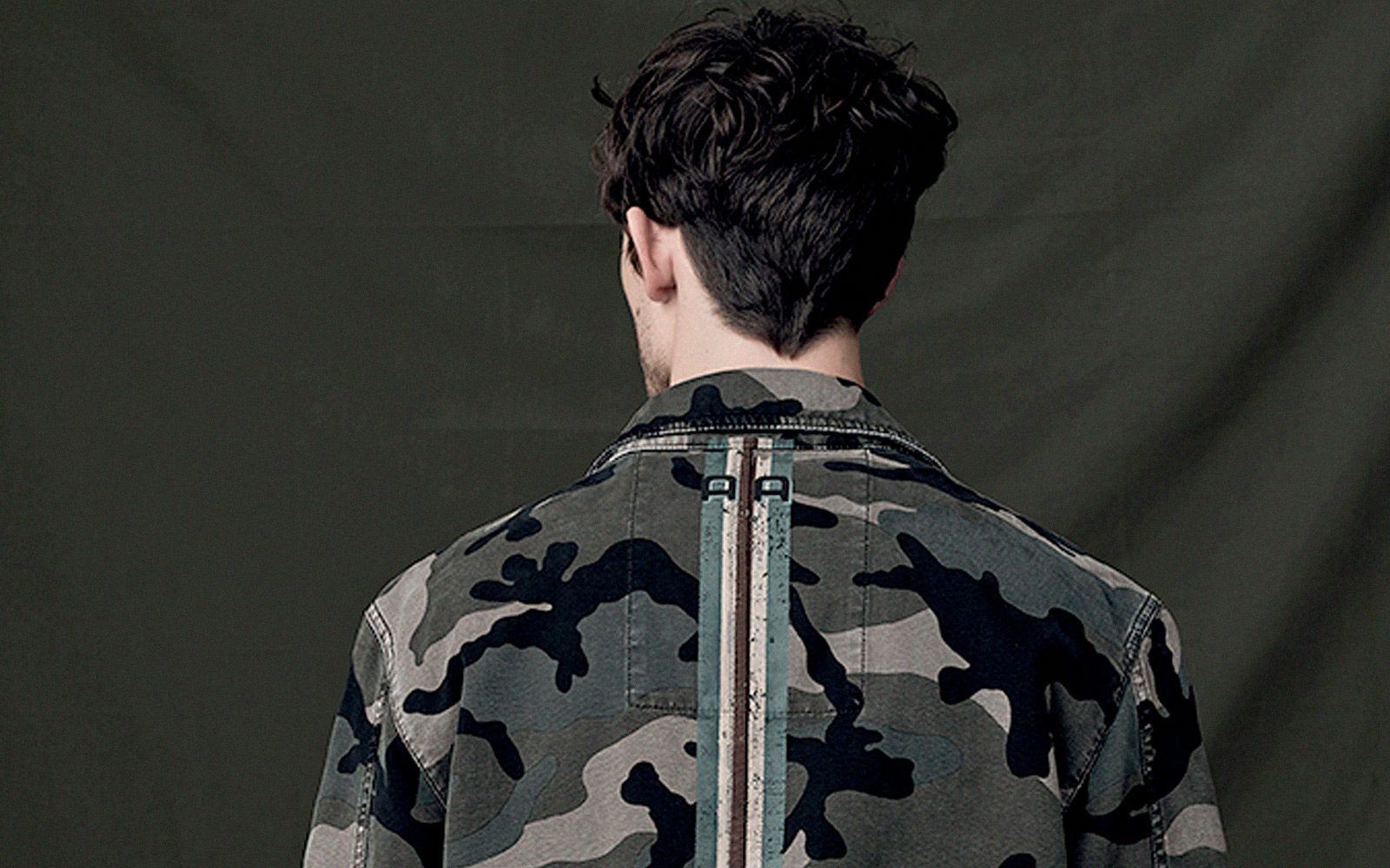 man wearing trendy camouflage jacket