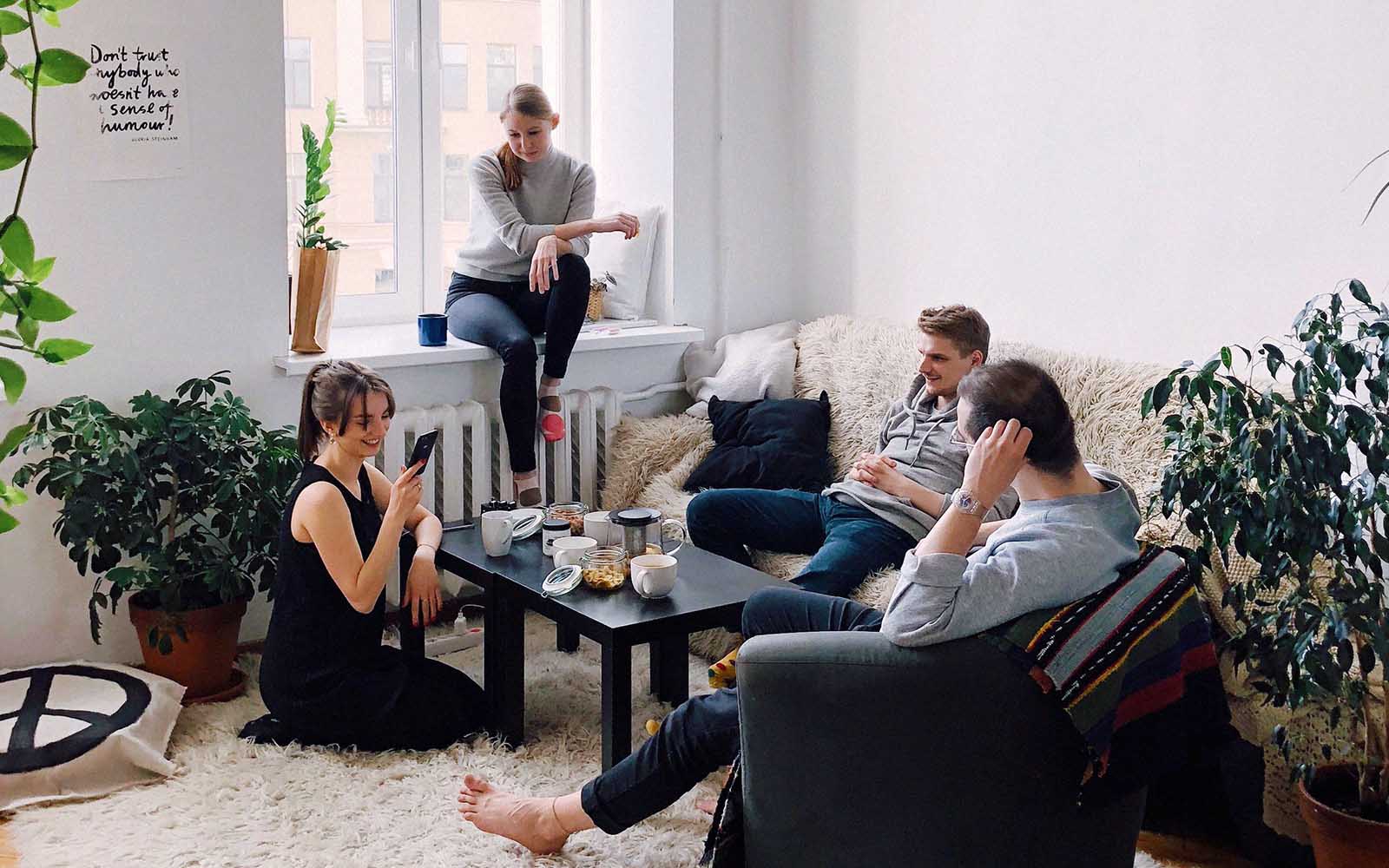 Group of friends sitting in a living room